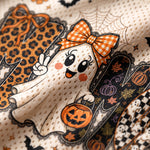 Close-up of a Halloween-themed fabric print featuring a cute cartoon ghost in an orange gingham bow, holding a jack-o'-lantern, with spiderwebs, pumpkins, bats, and patterned accents on a cream mesh background.