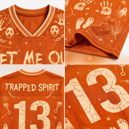 A four-panel close-up collage of an orange athletic jersey with Halloween-style cream graphics and text. The top-left panel shows the V-neck collar and part of the front with skull and handprint motifs.